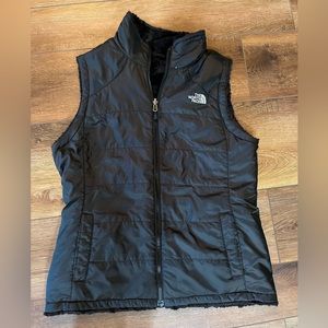 The North Face vest, size small, soft on one size and you can wear it either way